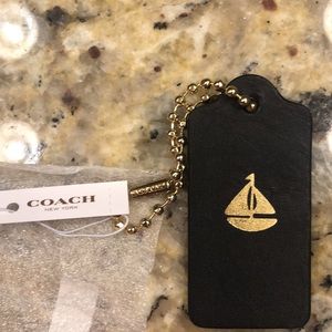 Coach Sailboat gold and black(or a very dark navy) charm 2.5 inch, logo on chain